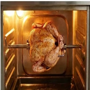 Chicken being tied and secured onto a rotisserie rod before roasting.