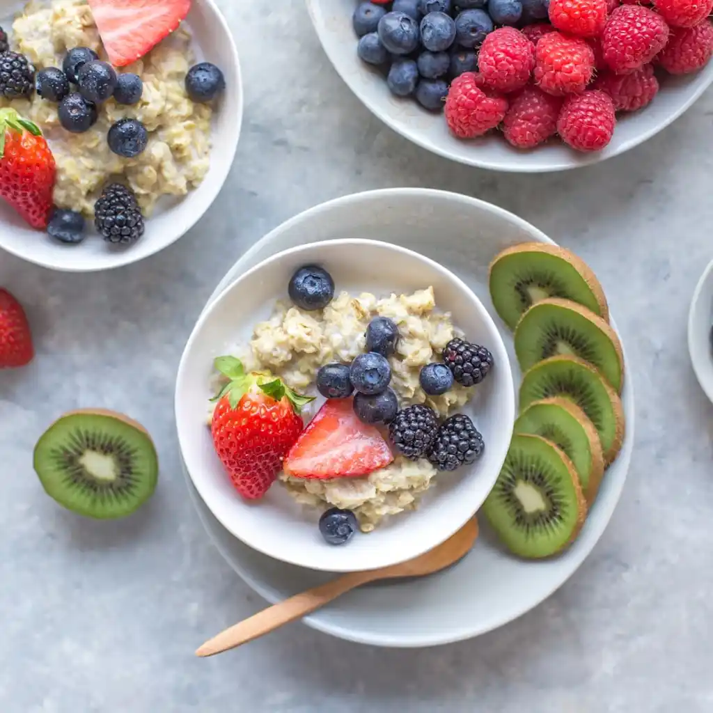 Oatmeal cookie protein shake with berries, oats, and fresh fruit for a filling meal replacement breakfast